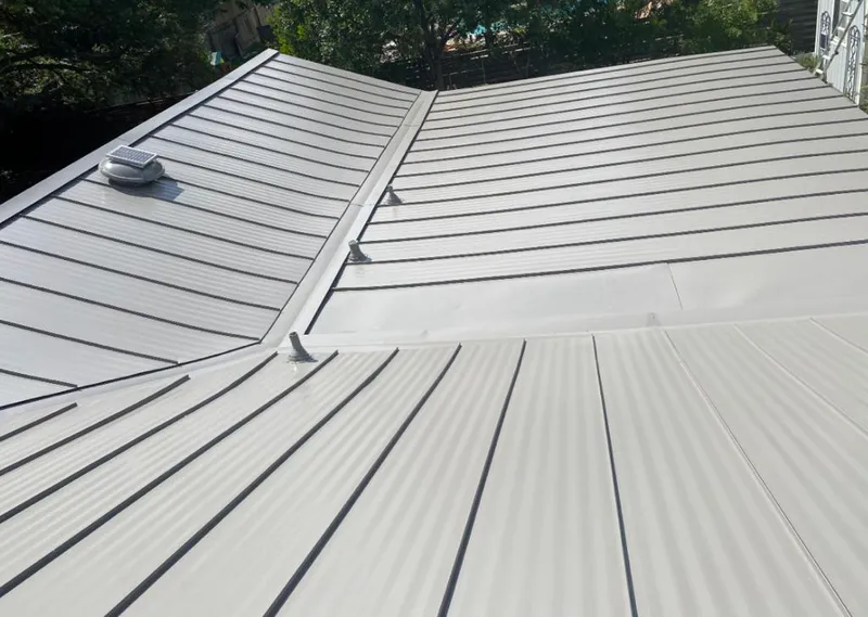 Solar attic fan installed on a metal roof for Roof Ventilation in Nipomo